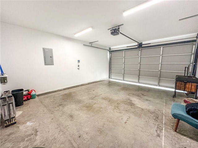 garage featuring a garage door opener and electric panel