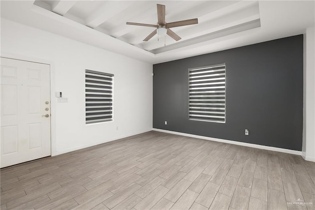 907 W Carmel Ave, Pharr, TX 78577 - unfurnished room with ceiling fan, a tray ceiling, wood finished floors, and baseboards