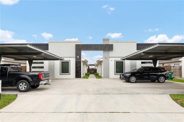 907 W Carmel Ave, Pharr, TX 78577 - view of front of property featuring stucco siding and covered parking