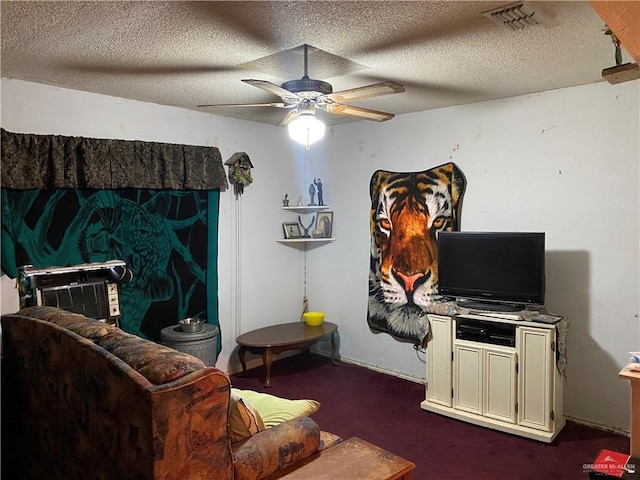 carpeted living room featuring a textured ceiling and ceiling fan