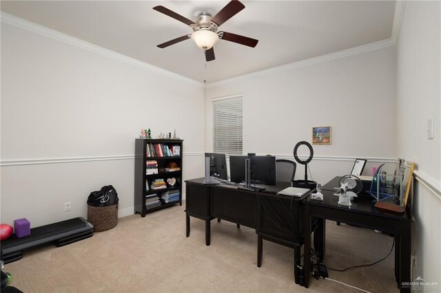 office area with ornamental molding, ceiling fan, and light colored carpet