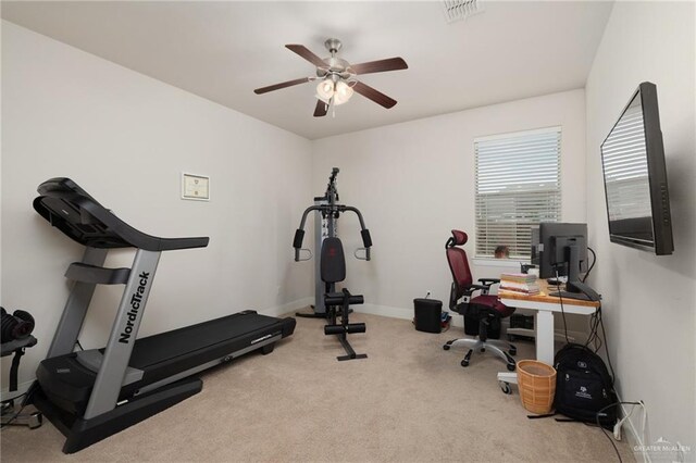 exercise room featuring visible vents, a ceiling fan, carpet flooring, and baseboards