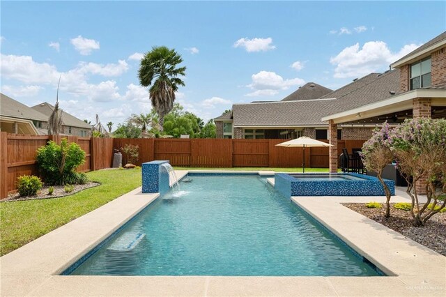 view of swimming pool with a pool with connected hot tub, a lawn, a fenced backyard, and a patio area