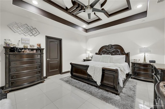 bedroom with a tray ceiling, light tile patterned floors, recessed lighting, a ceiling fan, and baseboards