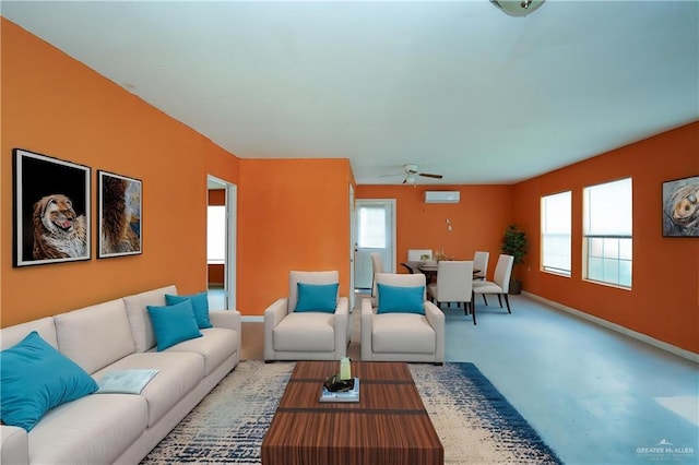 24834 Birch St, San Benito, TX 78586 - living room with a ceiling fan, baseboards, and finished concrete flooring