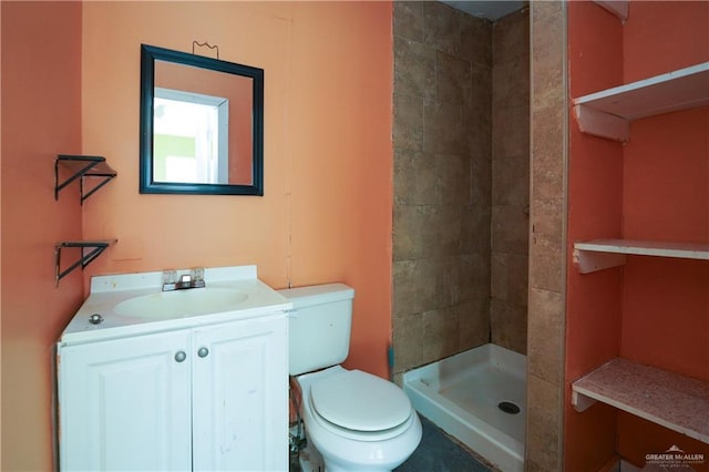 24834 Birch St, San Benito, TX 78586 - bathroom with tiled shower, vanity, and toilet