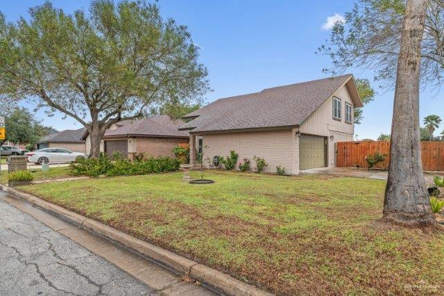 view of front property with a garage and a front yard