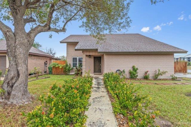 ranch-style house with a front lawn