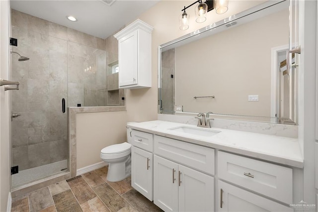 1008 Magnolia St, Mission, TX 78573 - full bathroom featuring toilet, vanity, a shower stall, and recessed lighting