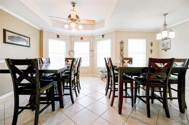4010 Blackhawk St, Edinburg, TX 78539 - dining area featuring plenty of natural light, a ceiling fan, crown molding, light tile patterned floors, and a raised ceiling