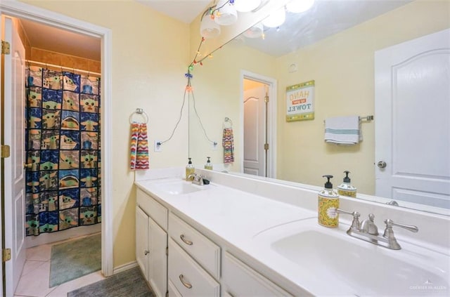 4010 Blackhawk St, Edinburg, TX 78539 - full bathroom featuring double vanity, tile patterned floors, and curtained shower