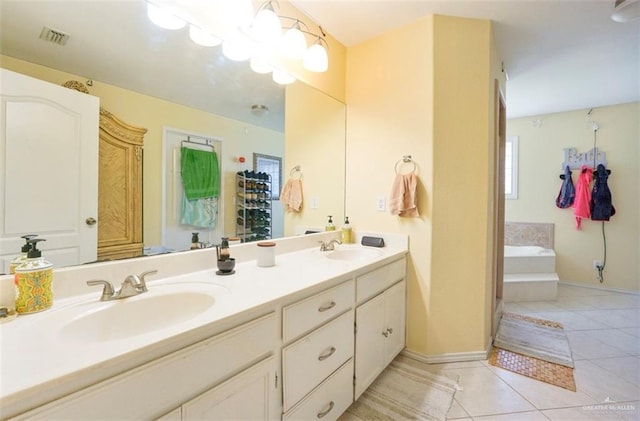 4010 Blackhawk St, Edinburg, TX 78539 - bathroom with double vanity, tile patterned flooring, and a bath