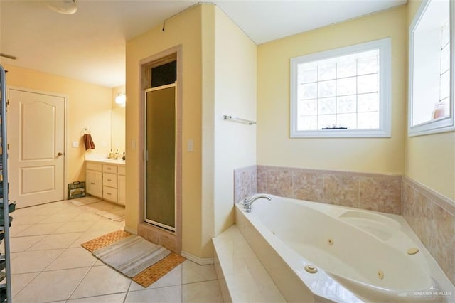4010 Blackhawk St, Edinburg, TX 78539 - full bathroom featuring vanity, tile patterned flooring, a shower stall, and a tub with jets