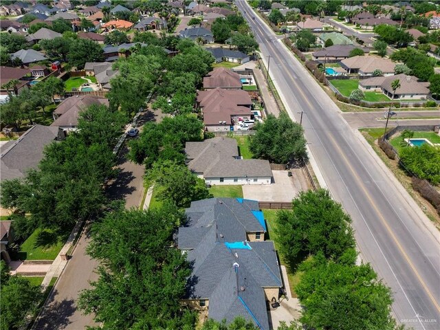 birds eye view of property with a residential view