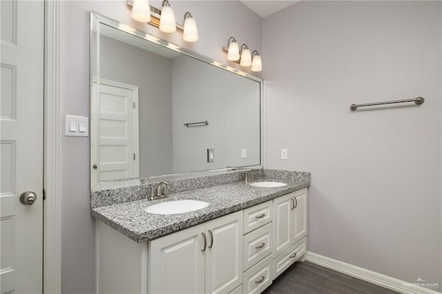 bathroom with vanity and hardwood / wood-style flooring