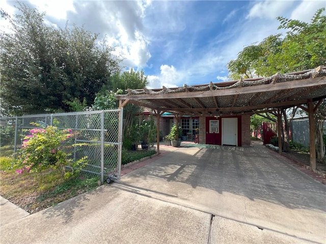 view of vehicle parking with a carport