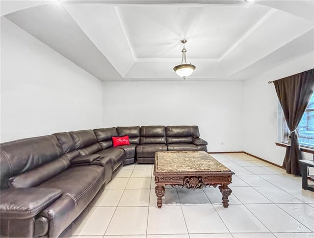 tiled living room featuring a raised ceiling