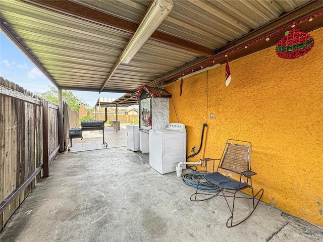 view of patio / terrace with separate washer and dryer