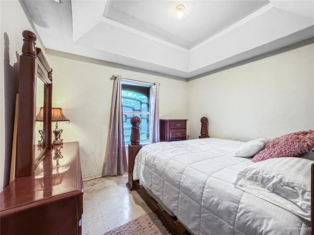 bedroom with a raised ceiling