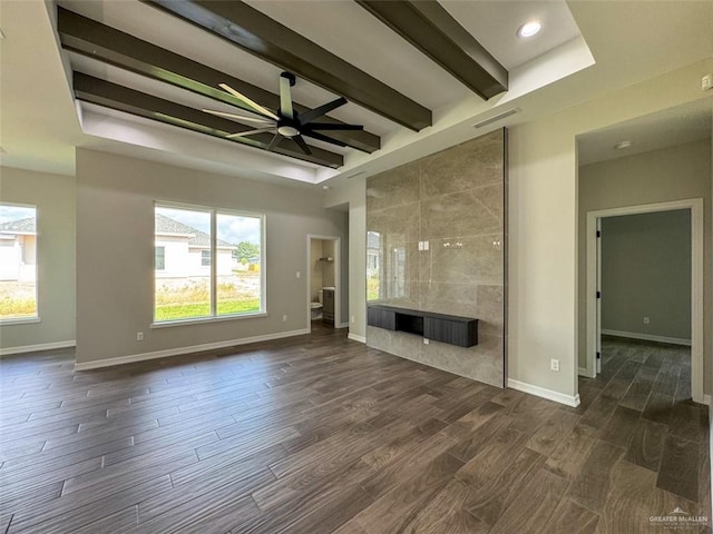 3807 Crimson St, Mission, TX 78574 - unfurnished living room with healthy amount of natural light, dark wood-type flooring, baseboards, and beam ceiling