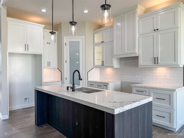 3807 Crimson St, Mission, TX 78574 - kitchen featuring a sink, baseboards, dark wood-style flooring, white cabinetry, and recessed lighting