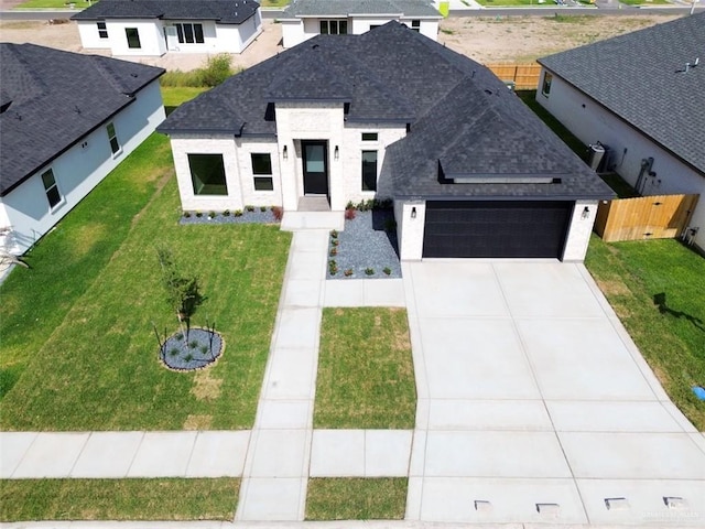 3807 Crimson St, Mission, TX 78574 - view of front of home with a garage, roof with shingles, and concrete driveway