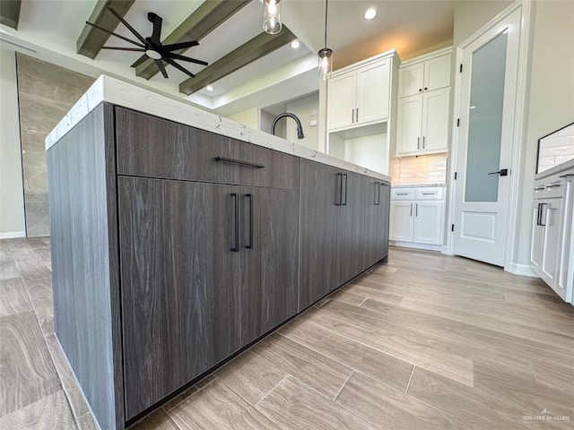 3807 Crimson St, Mission, TX 78574 - kitchen featuring white cabinets, ceiling fan, recessed lighting, decorative light fixtures, and decorative backsplash