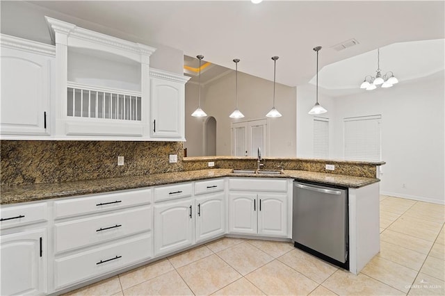 kitchen with white cabinetry, sink, dark stone counters, and stainless steel dishwasher