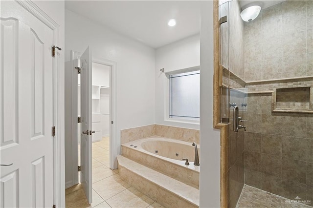 bathroom featuring shower with separate bathtub and tile patterned floors