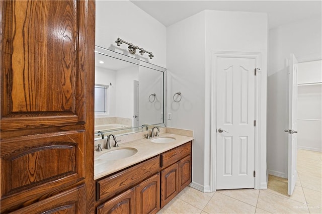 bathroom with tile patterned floors and vanity