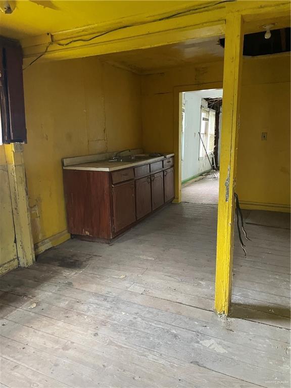 408 E Gardenia Ave, Hidalgo, TX 78557 - misc room featuring light wood finished floors