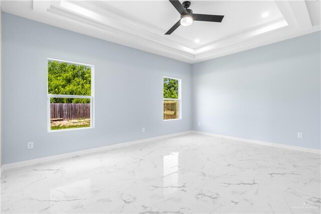 2903 E Zarzamora Ave, Hidalgo, TX 78557 - unfurnished room featuring ceiling fan, recessed lighting, marble finish floor, a raised ceiling, and baseboards
