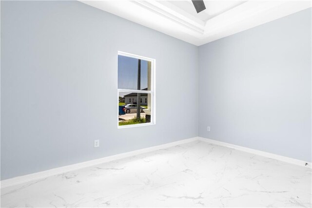 2903 E Zarzamora Ave, Hidalgo, TX 78557 - spare room with marble finish floor, a tray ceiling, and baseboards