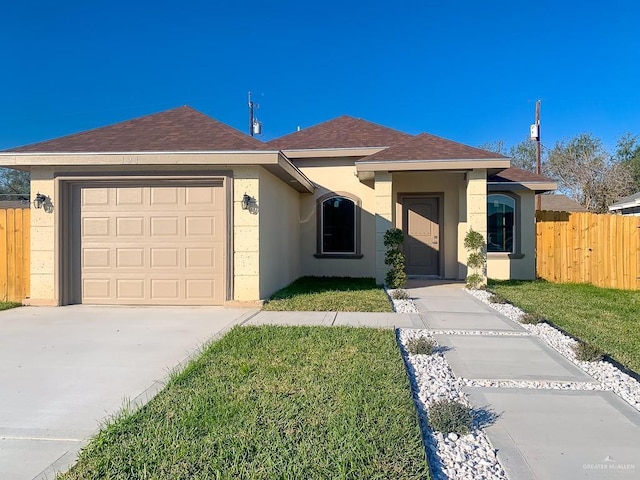 ranch-style home featuring a front yard and a garage