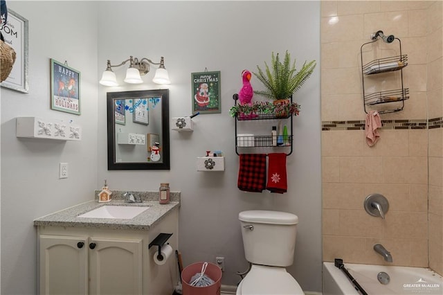 bathroom with vanity, toilet, and tub / shower combination