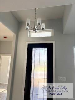 2906 Brushy Ct, Harlingen, TX 78552 - doorway to outside featuring a chandelier