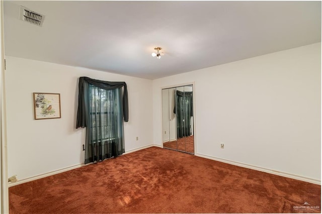 unfurnished room with carpet floors