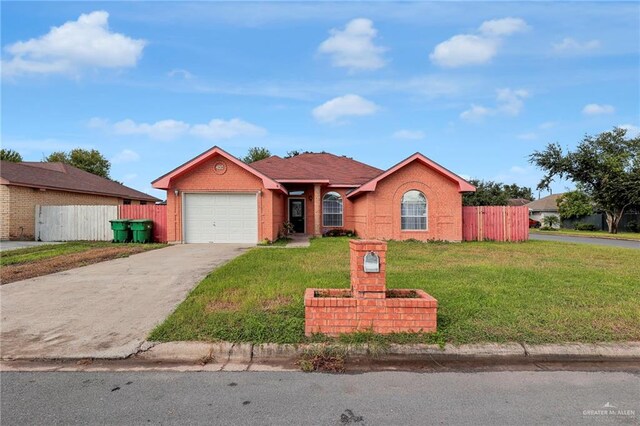 single story home with a garage and a front lawn