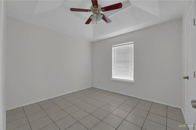 spare room featuring ceiling fan and light tile patterned floors