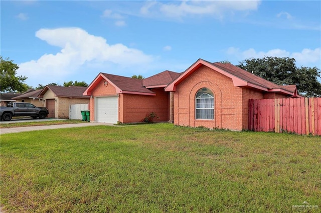 ranch-style home featuring a garage and a front lawn