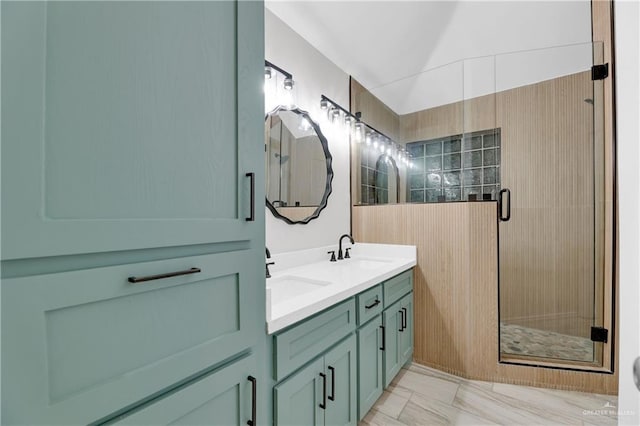 bathroom featuring vanity and a shower with shower door