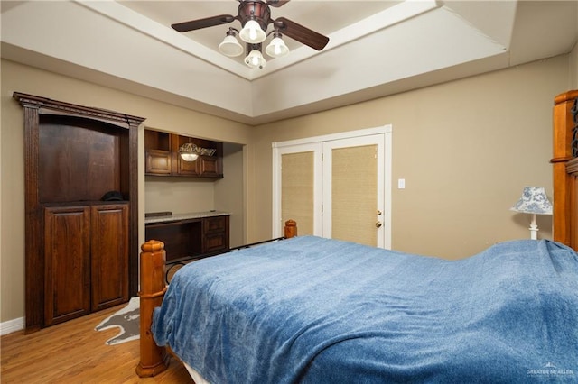 bedroom featuring ceiling fan and light wood-type flooring