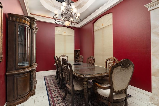 dining room with a raised ceiling and an inviting chandelier