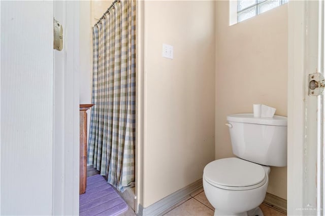 bathroom featuring tile patterned flooring and toilet