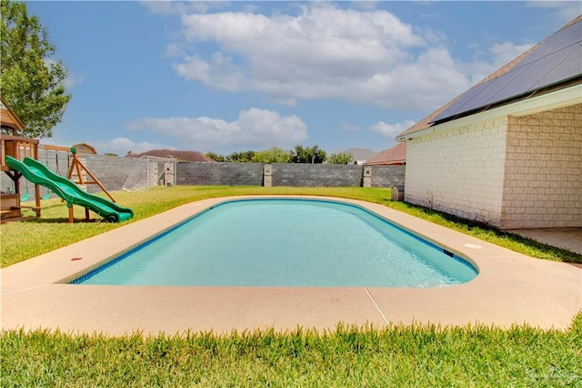 view of swimming pool featuring a playground