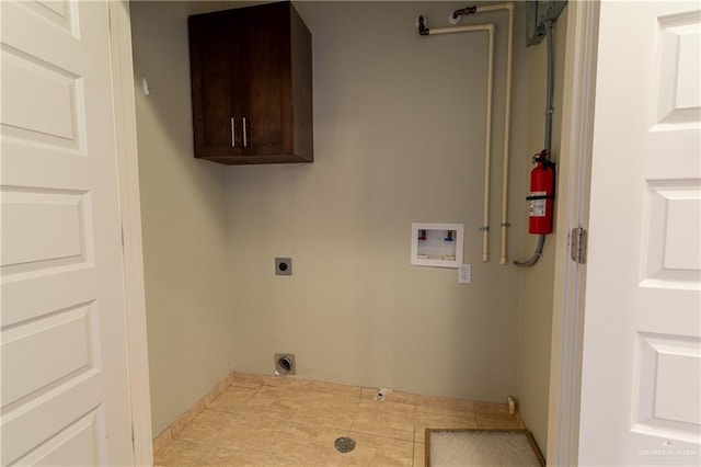 washroom with washer hookup, hookup for an electric dryer, and cabinets