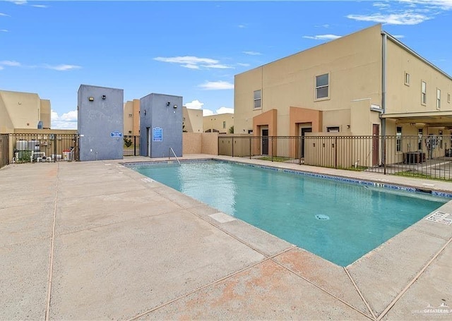 view of pool with central AC unit