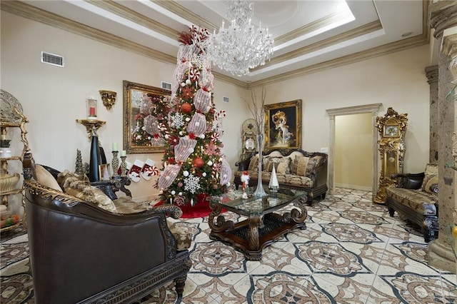 living room with an inviting chandelier, crown molding, and a raised ceiling