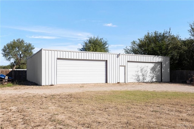 garage featuring a yard