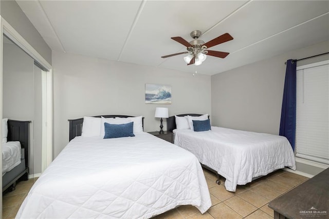 bedroom featuring tile patterned flooring and a ceiling fan